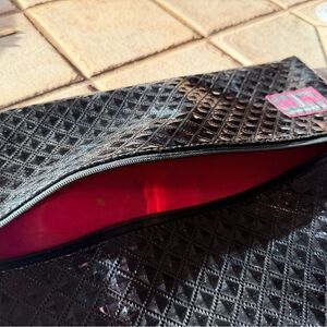 Elegant Black Cosmetic Bag with Red Interior